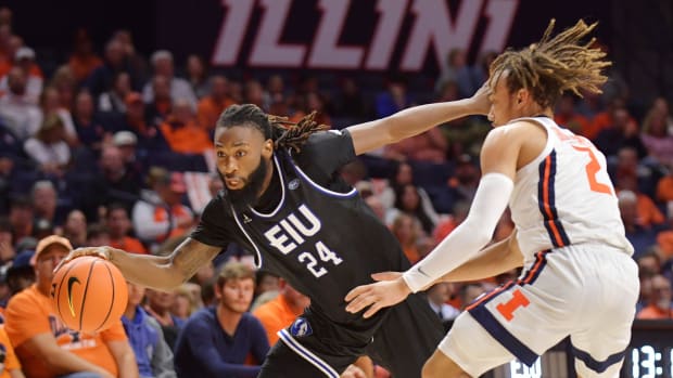 Nov 6, 2023; Champaign, Illinois, USA; Eastern Illinois Panthers guard Jaylin Gibson (24) dribbles the ball past Illinois Fighting Illini guard Dra Gibbs-Lawhorn (2) during the second half at State Farm Center. 